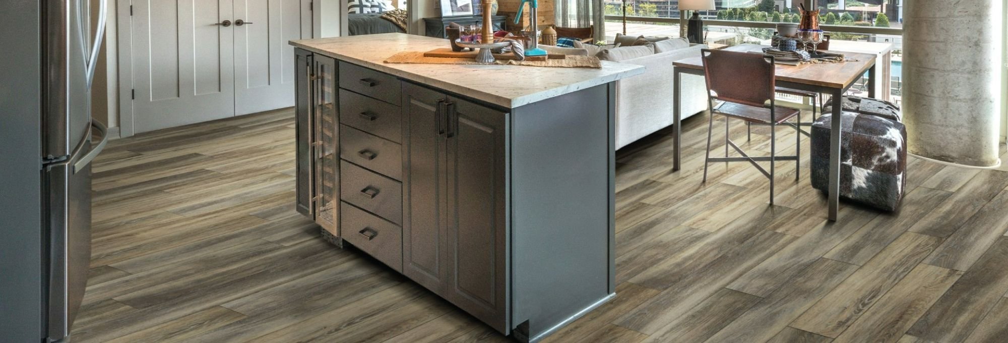 gray kitchen furniture and brown vinyl floor from The Carpet and Drapery Shoppe in Escanaba, MI